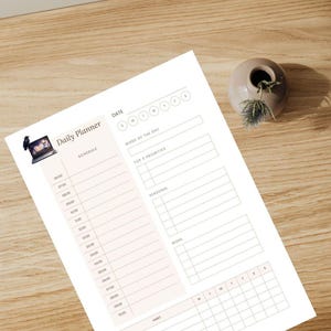 May include: A white daily planner sheet featuring a light pink schedule column with hourly slots from 06:00 to 10:00, a date section, a word of the day field, top 3 priorities, personal and work task lists, and a habit tracker grid at the bottom.