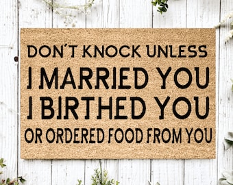 May include: A brown doormat with the text "Don't knock unless I married you, I birthed you, or ordered food from you."