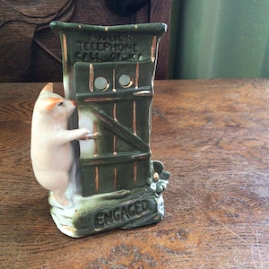Lovely Rare Pink Pig German Fairing/ spill vase. This one is a Piggy at a Public Telephone Call Office, titled Engaged.