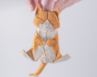 Origami cat. Cat hanging by the neck.