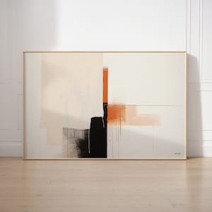 Könnte beinhalten: Abstraktes Gemälde mit minimalistischem Design in Schwarz, Weiß, Pfirsich und Orange. Das Gemälde ist in einem hellen Holzrahmen gerahmt.