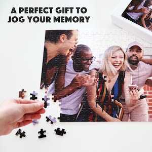 May include: A group of friends laughing together in a photo puzzle. The puzzle is partially assembled with a few pieces missing. The puzzle is a great gift for a friend or family member.