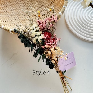May include: A dried flower bouquet featuring a mix of white, pink, and red blooms, accented with green foliage. The bouquet is tied with twine and includes a small tag that reads "Will you be my bridesmaid". The text "Style 4" is also visible.