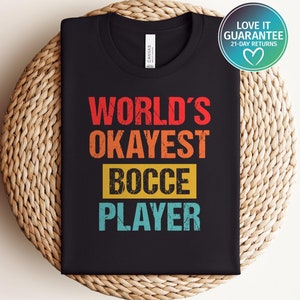 May include: Black t-shirt with a vintage-style graphic that says "World's Okayest Bocce Player".