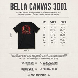 May include: Black Bella Canvas 3001 t-shirt with a red graphic of a cat wearing a hat and smoking a pipe. The shirt's size chart shows widths from 18 inches to 30 inches and lengths from 28 inches to 34 inches.