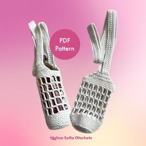 May include: Two white crocheted bottle holders with a grid pattern. The holders have long straps and are hanging against a pink and orange gradient background. The text "PDF Pattern" is written in a pink circle.