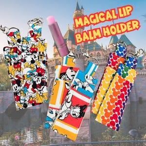 May include: Lip balm holders with various designs featuring Mickey Mouse, Minnie Mouse, and Donald Duck. The holders have a keychain clip and are in a variety of colors, including red, yellow, blue, and rainbow. The text "MAGICAL LIP BALM HOLDER" is visible.