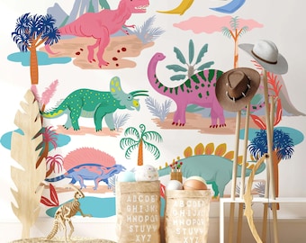 May include: A colorful dinosaur themed wall decal set with a pink T-Rex, a green Triceratops, a purple Brachiosaurus, and a blue Pterodactyl. The decal set also includes a volcano, palm trees, and clouds. The decal set is shown on a white wall with a wooden shelf and a brown rug.