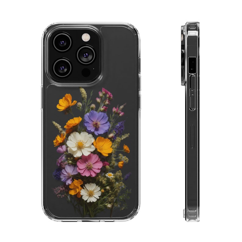 May include: A clear phone case with a floral design. The case features a bouquet of pressed flowers in shades of purple, pink, yellow, and white. The flowers are arranged in a cluster on a dark gray background.