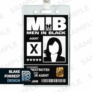May include: A black and white MIB (Men in Black) agent ID badge. The badge features the MIB logo, agent designation, a silhouette, and a security clearance level. The badge also includes the designer's name and a microchip.