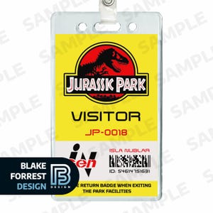 May include: A yellow and red Jurassic Park visitor badge with the text "VISITOR" and "JP-0018". The badge includes the Jurassic Park logo and the text "ISLA NUBLAR". The badge is in a clear plastic holder.