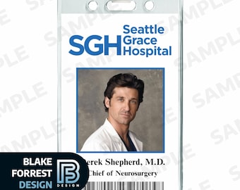 May include: Clear plastic ID badge featuring a photo of a man in a white coat. The badge includes the text "Seattle Grace Hospital" and "Derek Shepherd, M.D., Chief of Neurosurgery". The badge has a clip at the top and a barcode at the bottom.