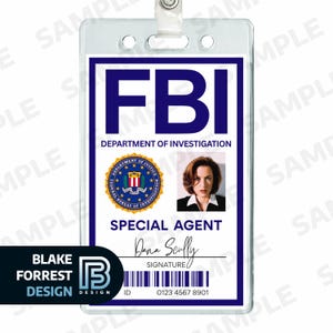 May include: FBI Special Agent ID badge featuring the text "FBI" in bold blue letters. The badge includes a photo, the agent's name "Dana Scully", and a barcode. The badge is in a clear plastic holder.