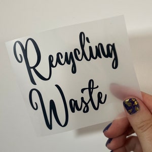 May include: A white sticker with black text that reads "Recycling Waste".