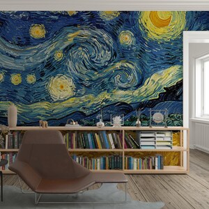 May include: A wall mural featuring a reproduction of The Starry Night with swirling blue and yellow brushstrokes. Below the mural is a long wooden bookshelf filled with various books, a white desk organiser, and small decorative objects.