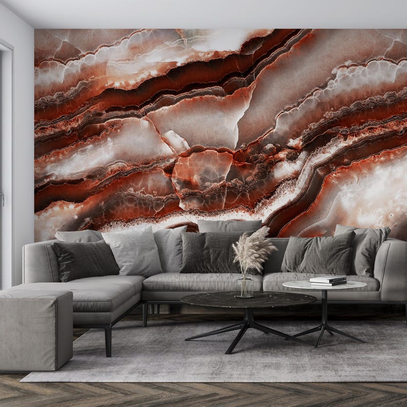 May include: A large wall mural featuring a high-resolution print of polished agate stone with deep red, burnt orange, and creamy white swirling bands. The pattern displays organic, layered mineral textures that span the entire wall surface.