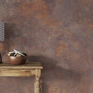 May include: A rustic brown textured wall with a wooden table and a bowl of decorative items, including a starfish.
