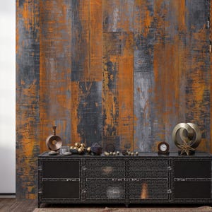 May include: A black metal media console with three drawers and three open shelves. The console has a distressed wood-look finish with orange and gray tones. The console is decorated with decorative metal orbs and a clock.