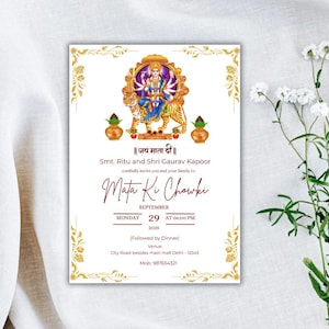 May include: A white invitation card with gold decorative borders and text. The card features an illustration of a deity riding a tiger, with text in English and Hindi. The invitation is for a Mata Ki Chowki event, scheduled for September 29, 2025.