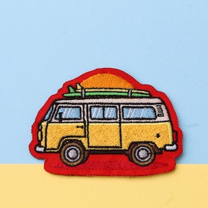 May include: An embroidered patch depicting a vintage van with a surfboard on top, set against a red sunset background.