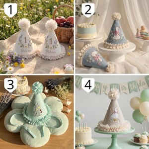 May include: A collection of four cone-shaped party hats featuring embroidered designs, including numbers, floral motifs, and a goose. Each hat is topped with a fabric pom-pom and finished with a ruffled trim at the base, crafted from soft fabric.