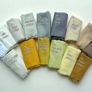 May include: A collection of fabric swatches in various colors, including pure white, milk cream, light beige, salt and pepper, light gray, dark gray, ginger beige, milo, coffee brown, and burnt sand. Each swatch is labeled with its color name.