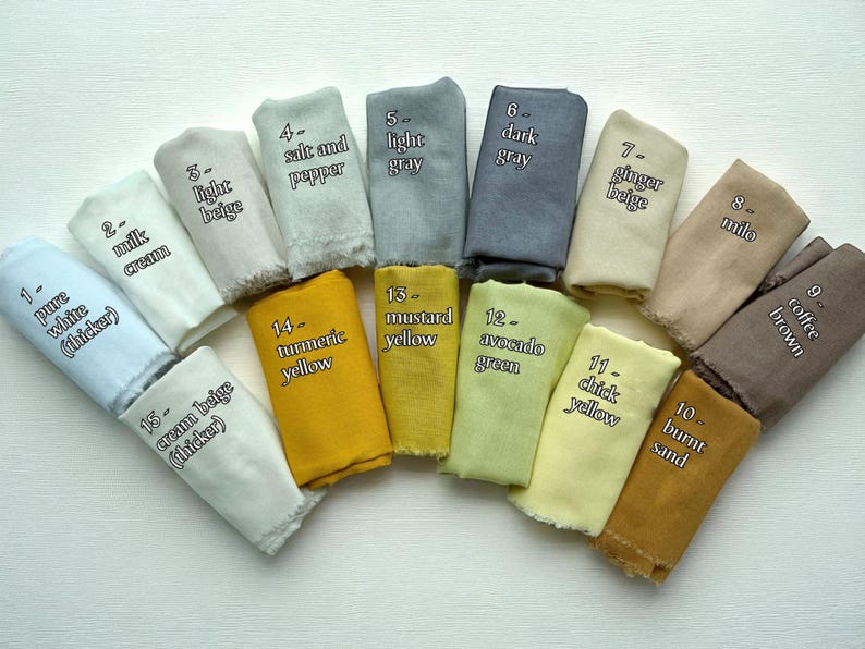 May include: A collection of fabric swatches in various colors, including pure white, milk cream, light beige, salt and pepper, light gray, dark gray, ginger beige, milo, coffee brown, and burnt sand. Each swatch is labeled with its color name.
