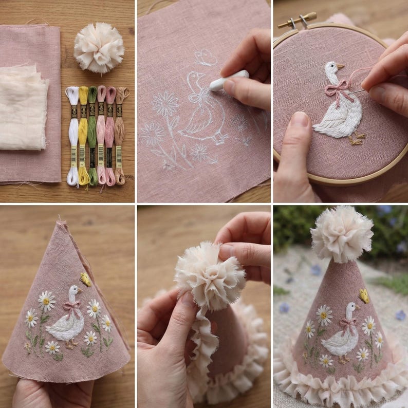 May include: A DIY embroidery kit featuring dusty pink fabric, six skeins of embroidery floss, a fabric pom-pom, and a wooden hoop. The project depicts a white goose with a pink bow surrounded by daisies and a butterfly, assembled into a cone hat.