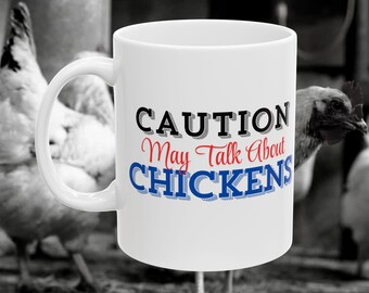 May include: White ceramic coffee mug with a black and blue design that says "CAUTION May Talk About CHICKENS".