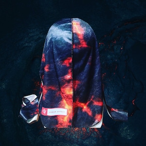 May include: A black and red patterned silk scarf with the text "URBAN EFFECT" printed on it.