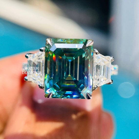 Three stone emerald on sale cut moissanite ring