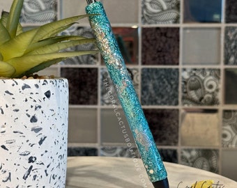 Penna glitterata con tartaruga marina