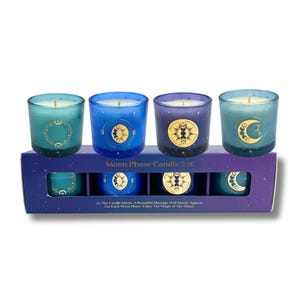 May include: Set of four teal and blue glass candle jars with gold moon phase designs. The candles are in a box with the text "Moon Phase Candle Set" and "As the candle burns, a beautiful message will slowly appear for each moon phase. Enjoy the magic of the moon!"
