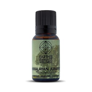 May include: A brown glass bottle with a black cap, labeled "EARTH'S ELEMENTS WELLNESS HIMALAYAN JUNIPER 100% Pure Organic Essential Oil 0.5 Fl Oz - 15 ml. PURIFYING - RELIEVING - CLEANSING"