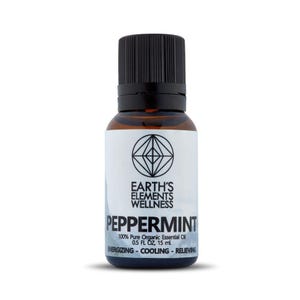 May include: A brown glass bottle of peppermint essential oil with a black cap. The label is white with black text that reads "EARTH'S ELEMENTS WELLNESS PEPPERMINT 100% Pure Organic Essential Oil 0.5 FL OZ, 15 ml. ENERGIZING - COOLING - RELIEVING".