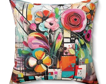 Almohadón cuadrado de gamuza sintética con flores impresionistas, lleno de color y estilo. Diseño floral con un aire de arte moderno sobre un almohadón suave.