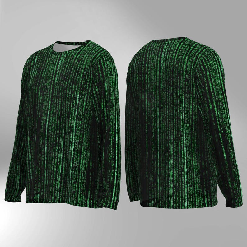 May include: Long-sleeved shirt featuring a black and green digital rain design. The pattern, reminiscent of computer code, covers the front and back of the shirt. It has a crew neck and long sleeves. The design is a series of vertical lines of green characters.