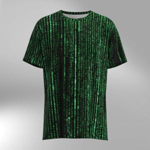 May include: Black t-shirt with a green digital rain pattern. The design features vertical lines of green characters, creating a matrix-like effect. The short-sleeved shirt is a casual wear item.