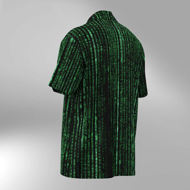 May include: Black short-sleeved button-up shirt with a green binary code pattern. The shirt has a classic collar and a relaxed fit. The design features vertical lines of green characters on a black background, creating a digital aesthetic.