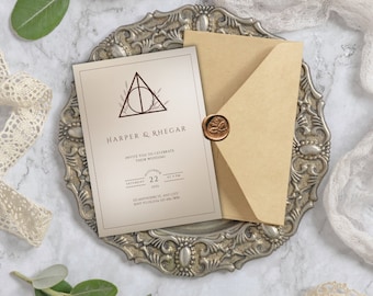 May include: A wedding invitation with a brown envelope and a wax seal. The invitation features a beige background with a brown and gold illustration of the Deathly Hallows symbol from the Harry Potter series. The text reads "Harper & Rhegar" and "Invite you to celebrate their wedding" with the date "Saturday 22 November 2023" and the time "at 5 PM". The address is "121 Anywhere St, Any City, 12345, 555-555-5555".