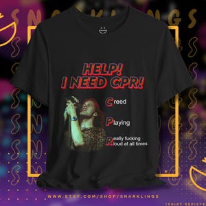 May include: Black t-shirt with a red and white graphic that says "HELP! I NEED CPR!" with the letters C, P, and R standing for Creed, Playing, and Really fucking loud at all times.
