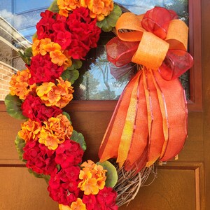 Orange and red oval grapevine wreath for summer and fall!