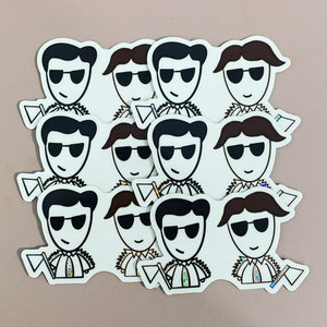 May include: A set of ten black and white cartoon stickers featuring characters wearing sunglasses and holding a small flag. The characters have different hairstyles and facial expressions.