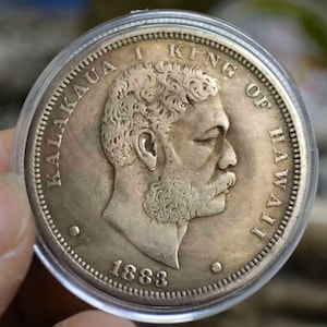 Rare 1883 Hawaiian 1 Dollar Coin Own a piece of American and Hawaiian history from the Kingdom of Hawaii, featuring King Kalakaua