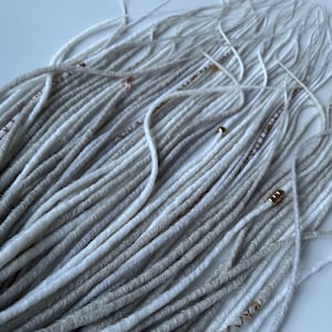 Blonde synthetic dreadlocks and silver dreads with braids and accessories fake hair extensions