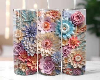 May include: Three stainless steel tumblers with a floral design. The tumblers are decorated with a variety of pastel-colored flowers, including roses, daisies, and lilies. The flowers are arranged in a realistic, three-dimensional style, giving the tumblers a unique and eye-catching look.