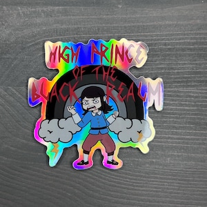 May include: Holographic sticker with a cartoon character and the text "HIGH PRINCE OF THE BLACK REALM." The character wears a blue shirt and red trousers, set against a rainbow and lightning bolts.