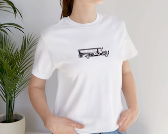 May include: White t-shirt with a black and white illustration of a jeepney, a type of public transportation vehicle common in the Philippines.