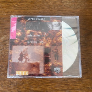 May include: A CD case with a brown and white background. The text "Depeche Mode" and "interview cd speaking only..." is printed on the front. The CD is visible through the clear plastic case.