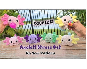 May include: A collection of colorful, plush axolotl stress pets in pink, purple, green, and yellow. The image includes the text "SQUEEZE!" and "Axolotl Stress Pet No Sew Pattern". The axolotls are displayed on a wooden surface.